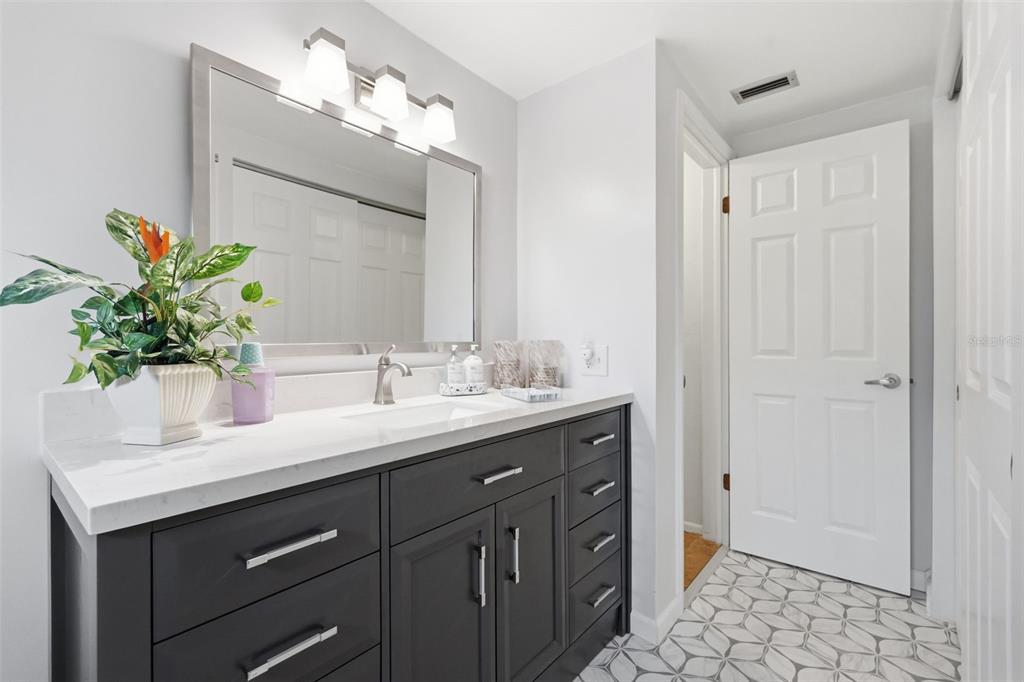 9420 Glen Moor Lane Port Richey, FL 34668 - Photo 31 of 36 a bathroom with a sink and a mirror