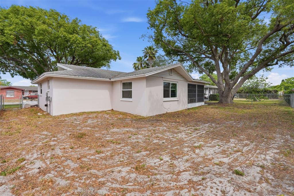 9420 Glen Moor Lane Port Richey, FL 34668 - Photo 35 of 36 a view of a house with a yard
