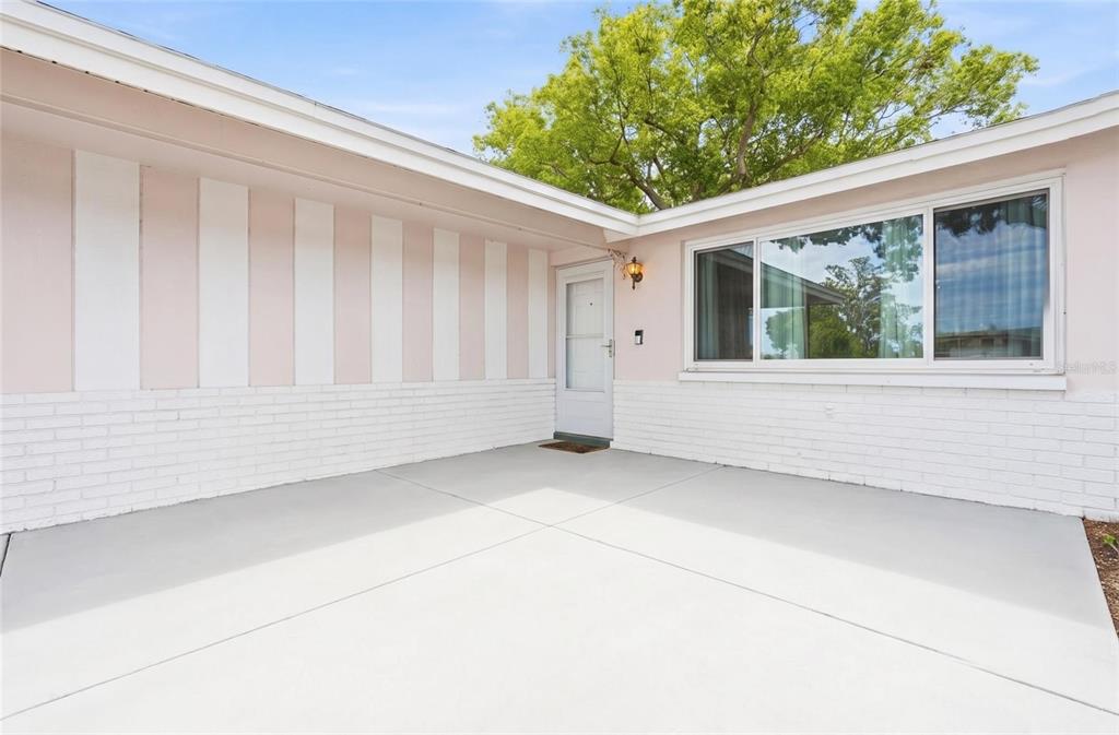 9420 Glen Moor Lane Port Richey, FL 34668 - Photo 5 of 36 a view of an empty room with a window and balcony