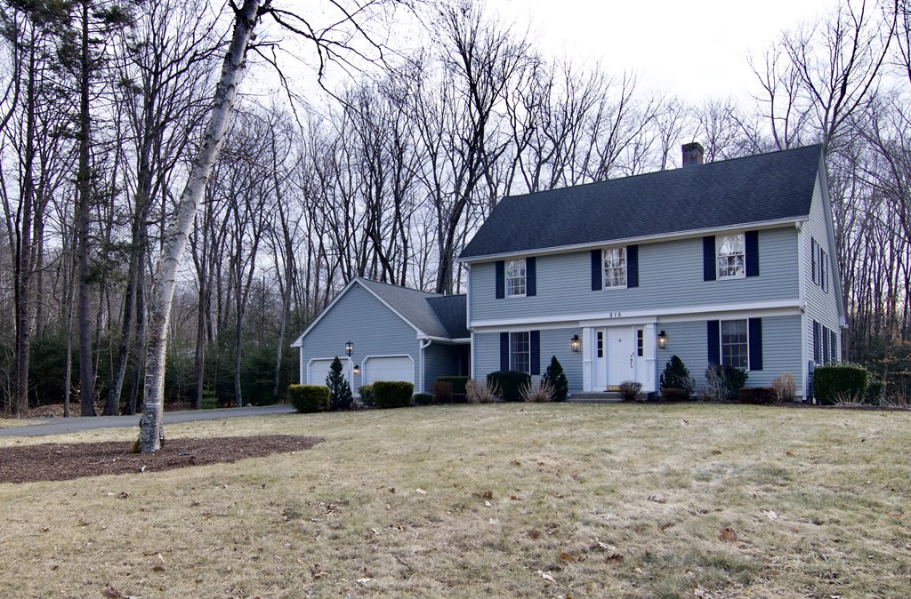 215 Maynard Road Wilbraham, MA 01095 - Photo 1 of 42 a front view of a house with a yard