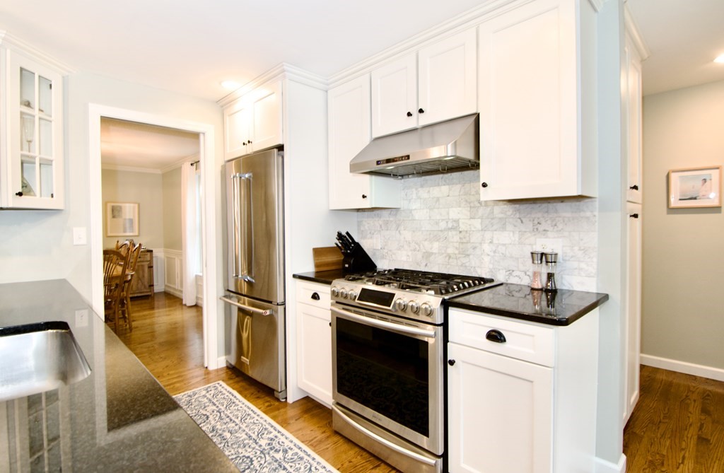 215 Maynard Road Wilbraham, MA 01095 - Photo 12 of 42 a kitchen with stainless steel appliances granite countertop a sink a stove a refrigerator and cabinets