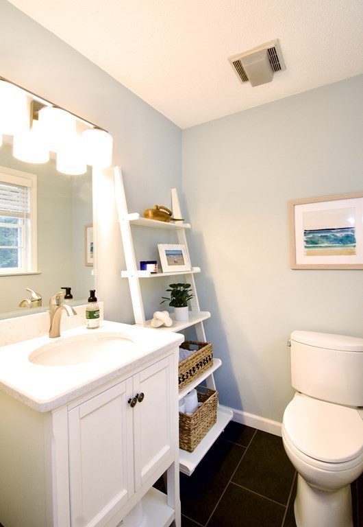 215 Maynard Road Wilbraham, MA 01095 - Photo 21 of 42 a bathroom with a sink a toilet and a mirror