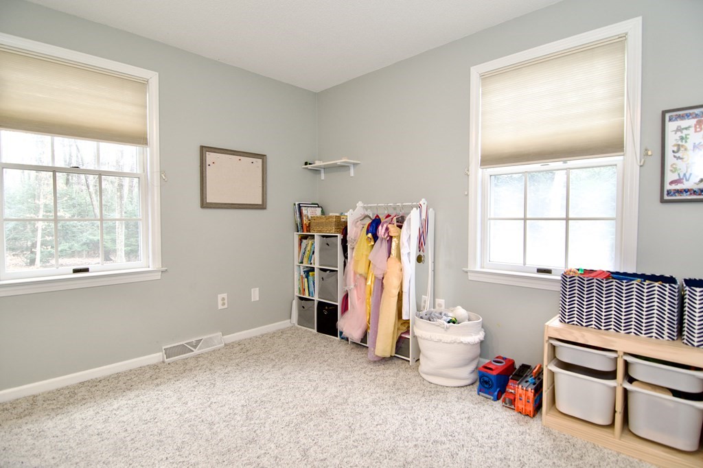 215 Maynard Road Wilbraham, MA 01095 - Photo 28 of 42 a bedroom with furniture and a window