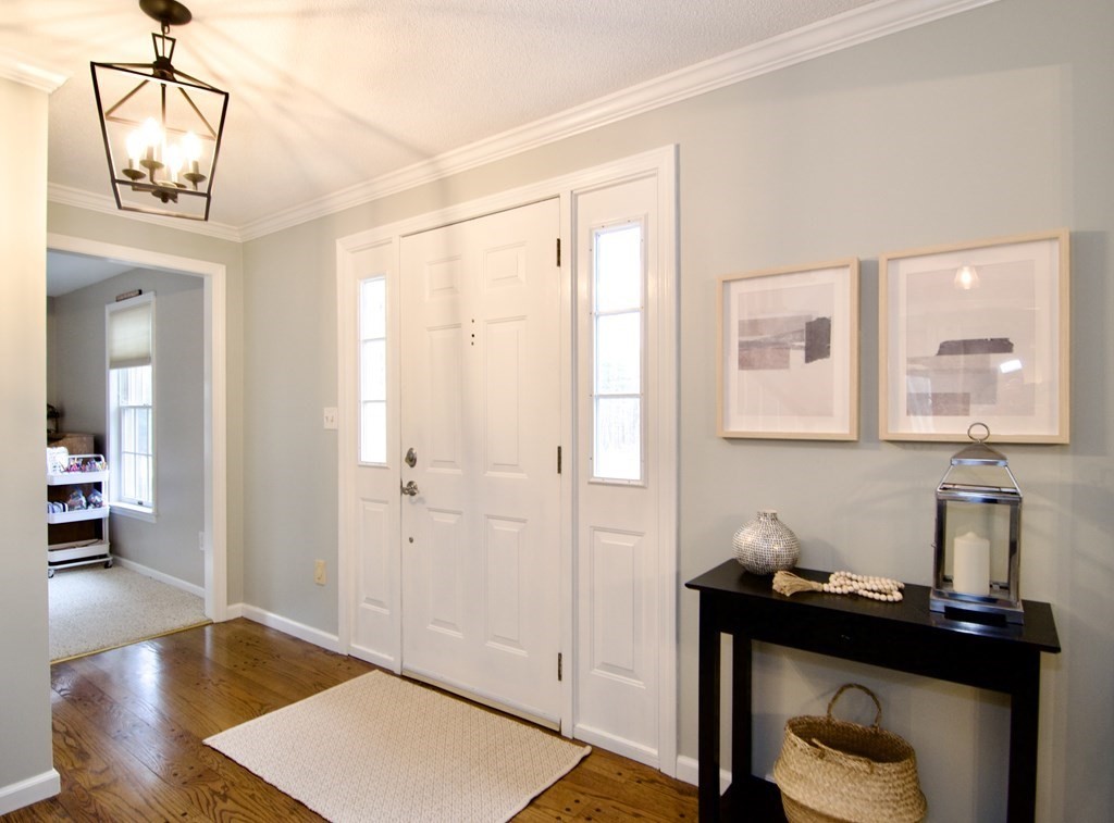 215 Maynard Road Wilbraham, MA 01095 - Photo 31 of 42 a view of a hallway with workspace and wooden floor