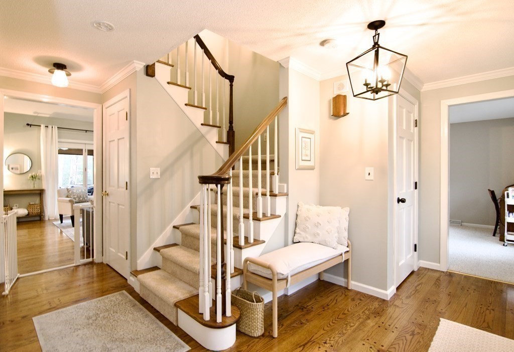 215 Maynard Road Wilbraham, MA 01095 - Photo 32 of 42 a view of a hallway with wooden floor and staircase