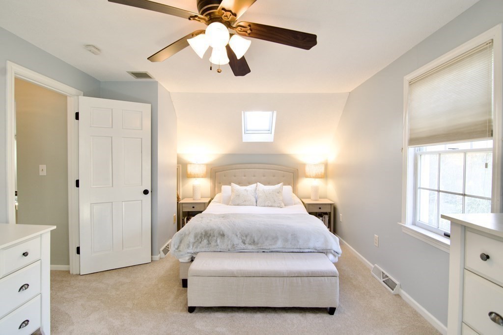215 Maynard Road Wilbraham, MA 01095 - Photo 35 of 42 a spacious bedroom with a bed and a window