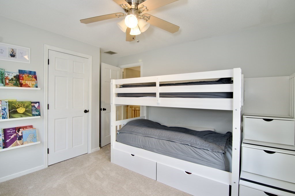 215 Maynard Road Wilbraham, MA 01095 - Photo 39 of 42 a bedroom with a bed and a ceiling fan