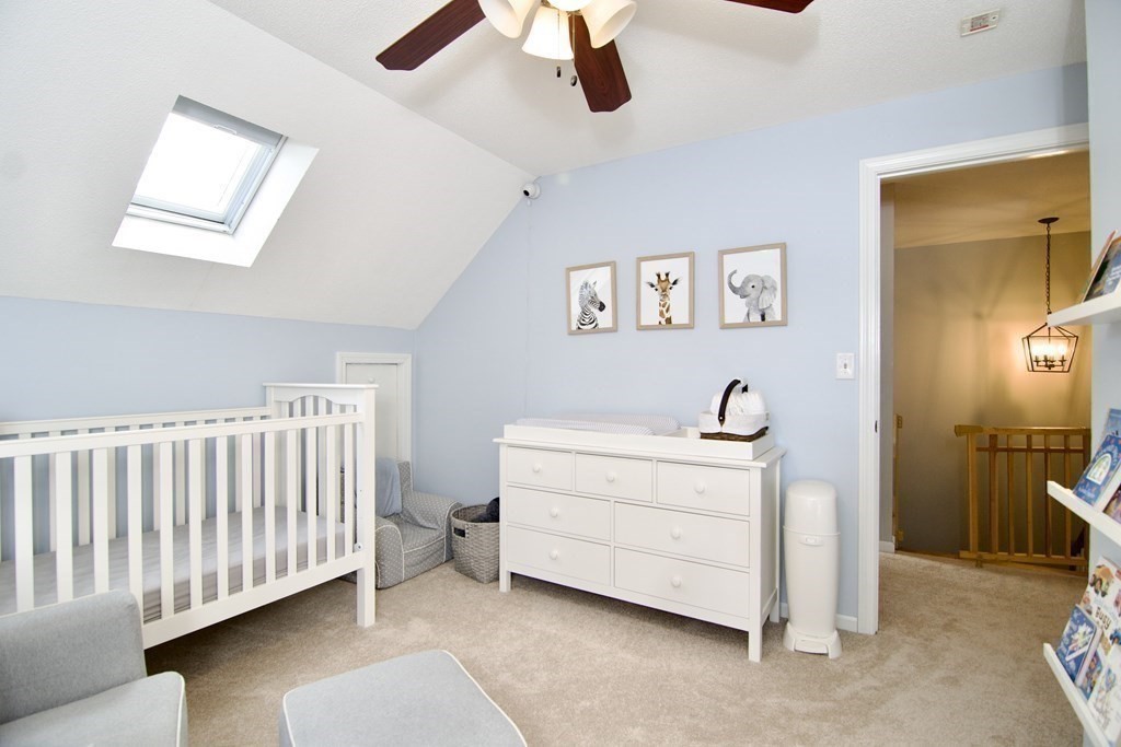 215 Maynard Road Wilbraham, MA 01095 - Photo 42 of 42 a room with a baby crib furniture and a window