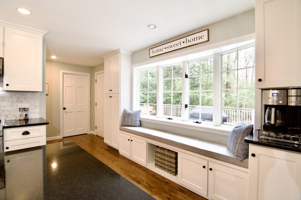 215 Maynard Road Wilbraham, MA 01095 - Photo 9 of 42 a large white kitchen with a large window and a counter space