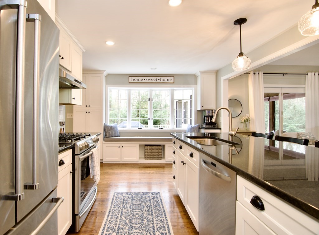 215 Maynard Road Wilbraham, MA 01095 - Photo 10 of 42 a kitchen with a sink stove and refrigerator
