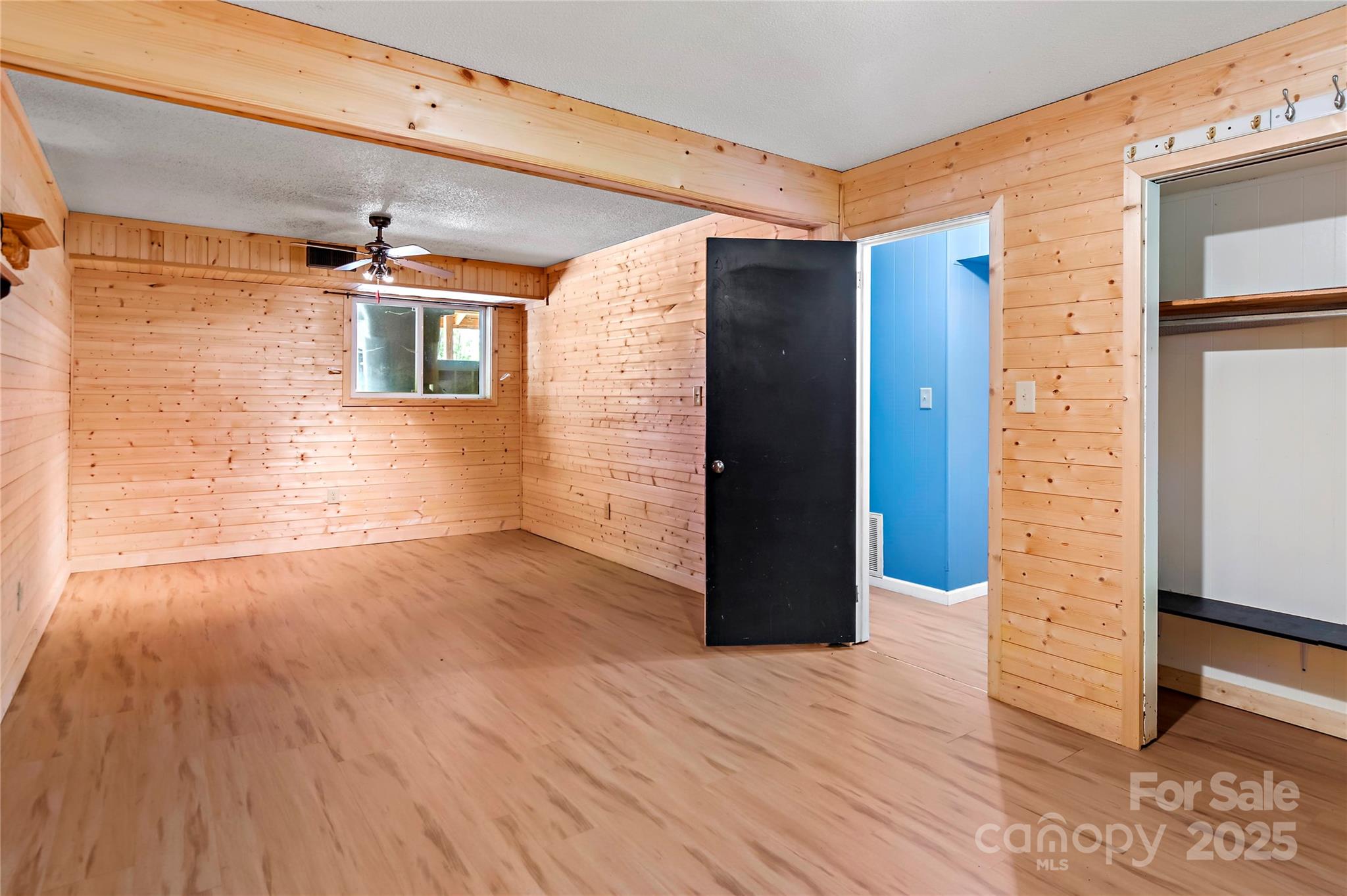 2950 Beroth Road Pfafftown, NC 27040 - Photo 17 of 39 a view of an empty room with wooden floor and a window