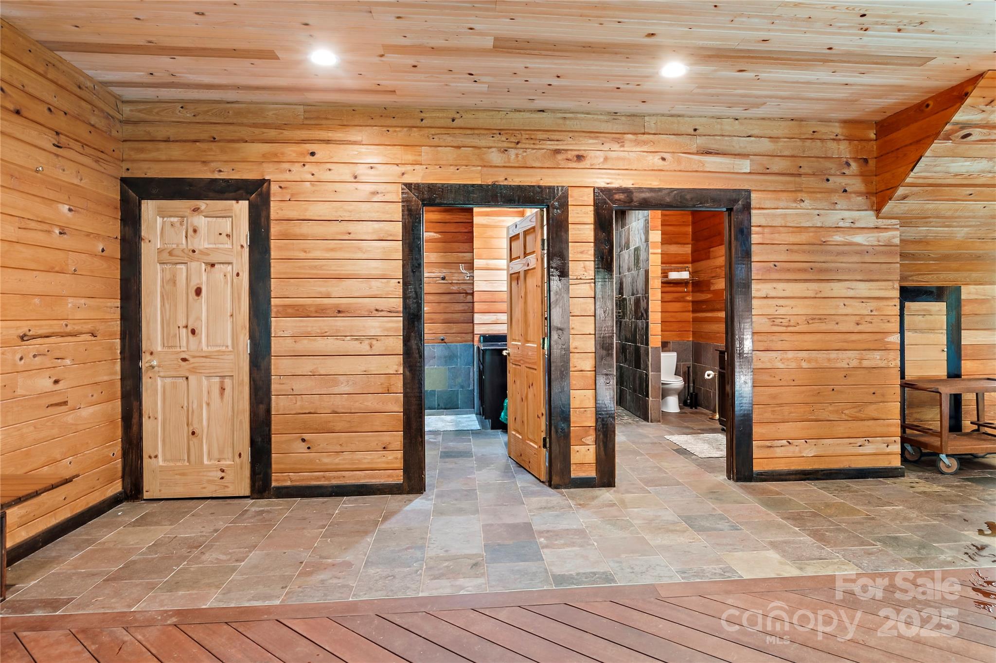 2950 Beroth Road Pfafftown, NC 27040 - Photo 23 of 39 a view of a hallway with wooden walls