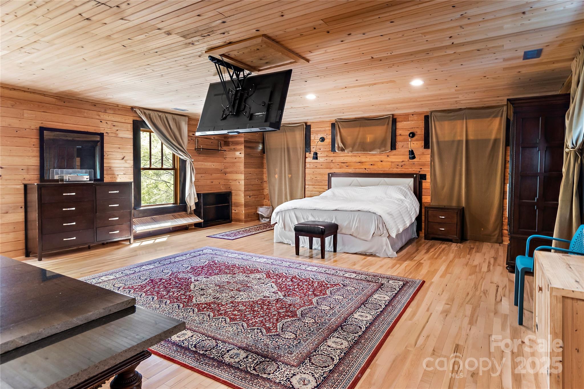 2950 Beroth Road Pfafftown, NC 27040 - Photo 31 of 39 a bedroom with furniture and a flat screen tv