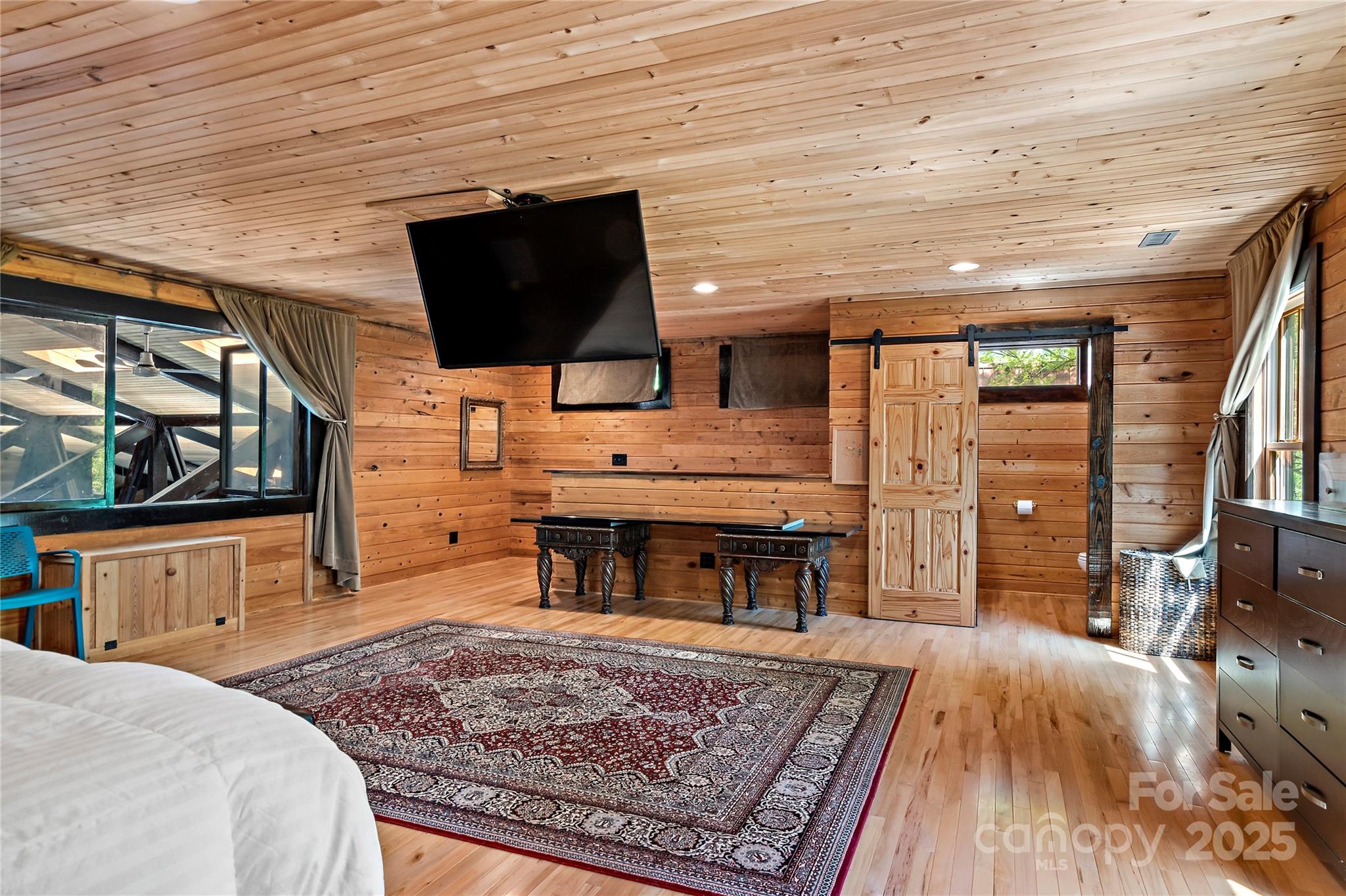 2950 Beroth Road Pfafftown, NC 27040 - Photo 32 of 39 a living room with furniture and a flat screen tv