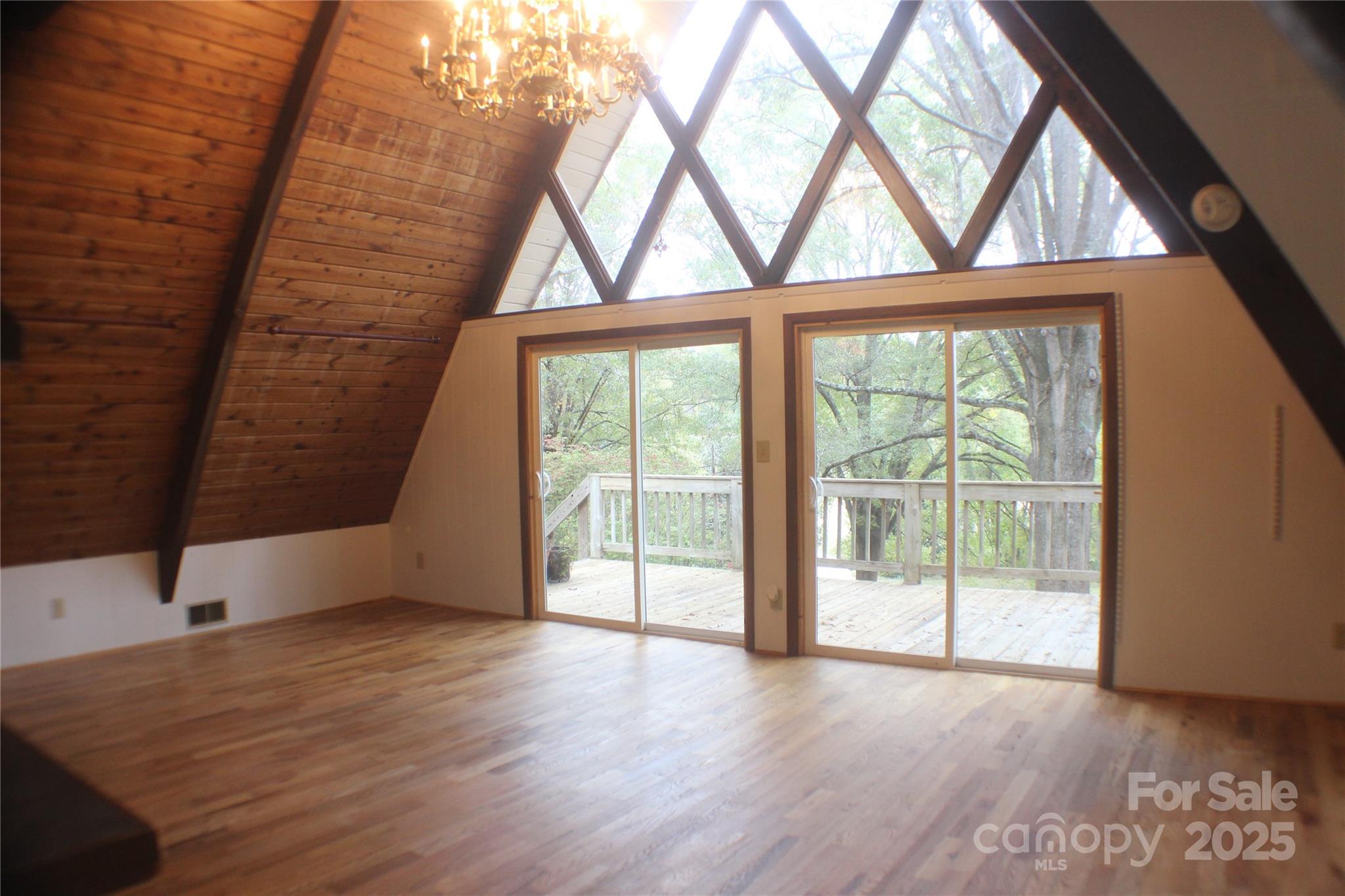 2950 Beroth Road Pfafftown, NC 27040 - Photo 7 of 39 wooden floor in an empty room with a window