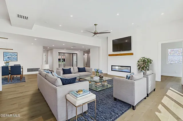 a view of kitchen and hall with wooden floor