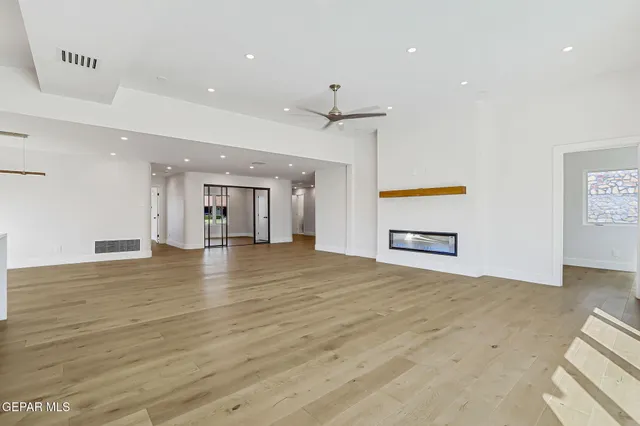 a kitchen with lots of counter space and a chandelier