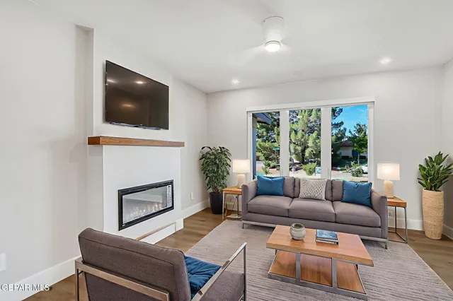 a kitchen with kitchen island a sink dishwasher a stove and a wooden floors