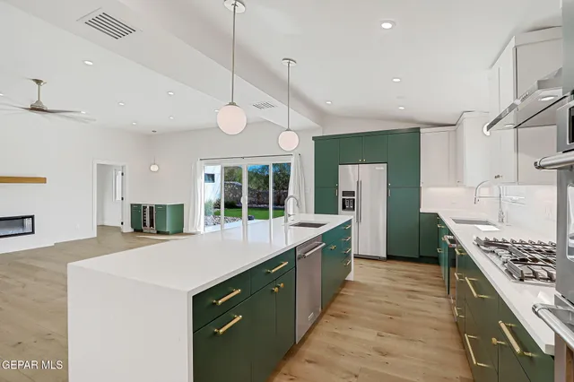 a bathroom with a sink mirror toilet and bathtub