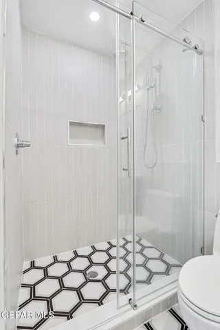 a kitchen with stainless steel appliances a sink and cabinets