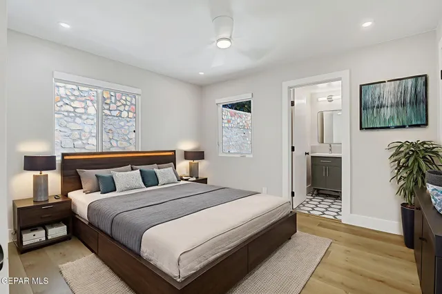 a bathroom with a toilet a sink and a mirror