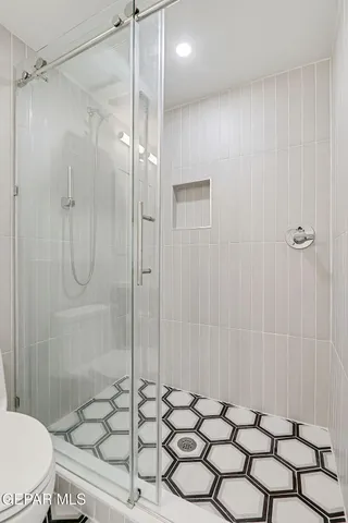 an aerial view of a house with a swimming pool