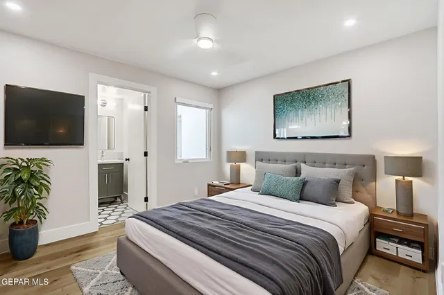 an aerial view of a red and white house with a trees in the background