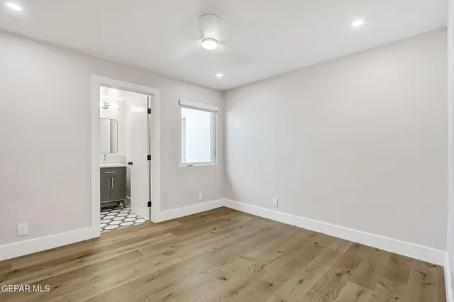 an aerial view of multiple houses with outdoor space