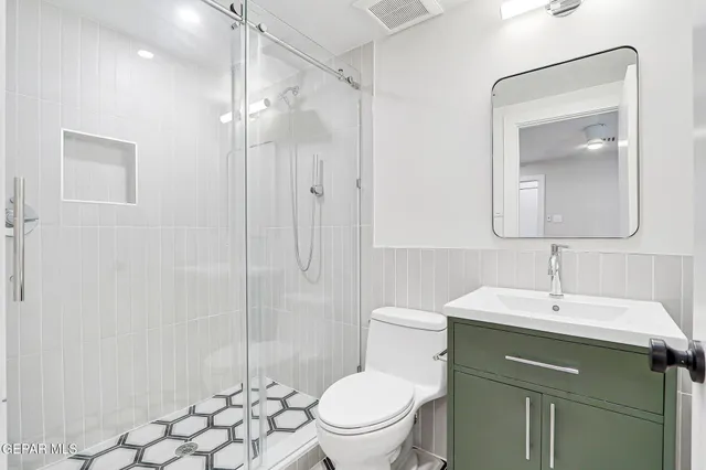 an aerial view of residential house with outdoor space and swimming pool