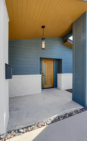 a living room with fireplace furniture and a flat screen tv