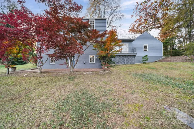 a backyard of a house with lots of green space
