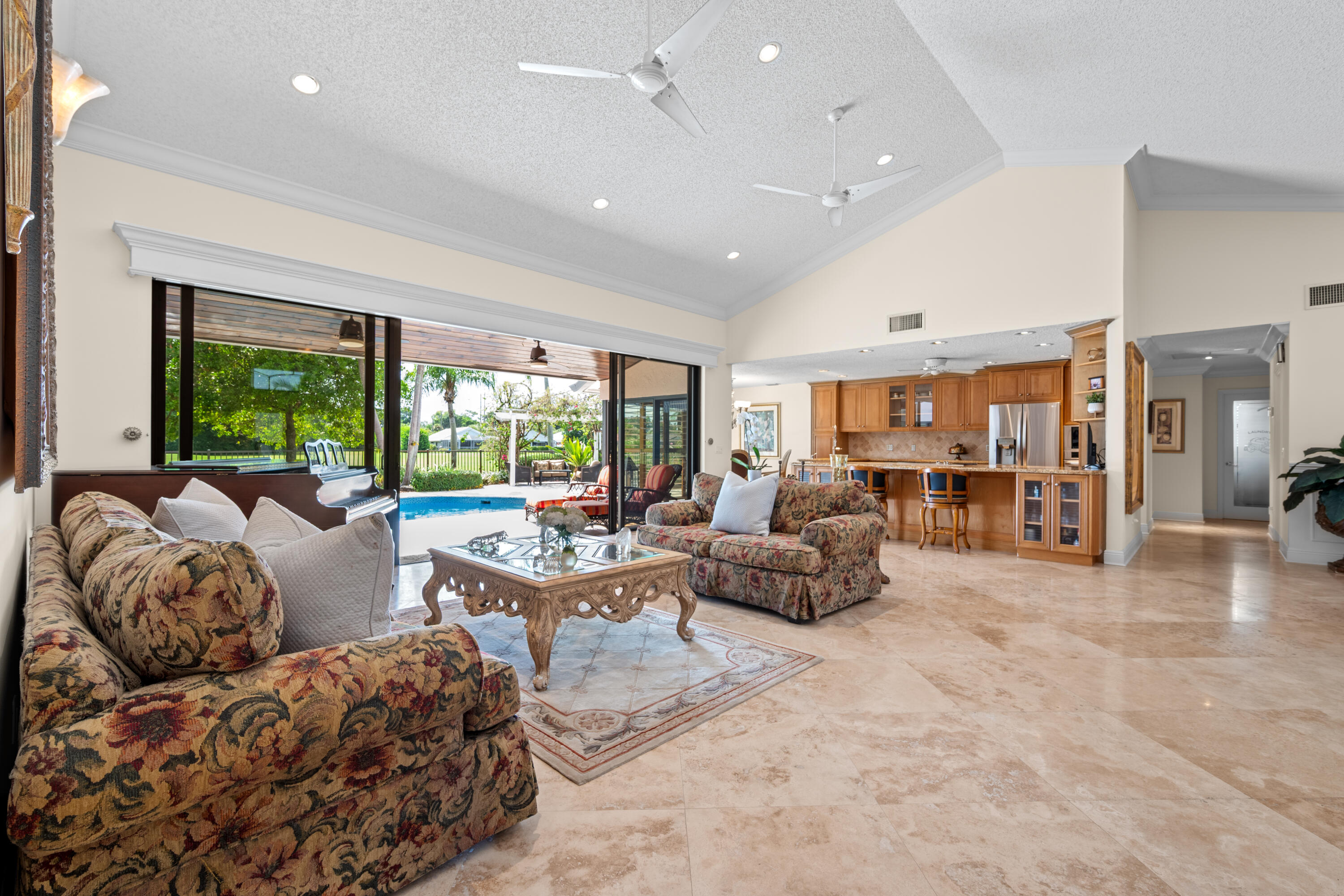 10984 Boca Woods Lane Boca Raton, FL 33428 - Photo 12 of 80 a living room with furniture and large windows