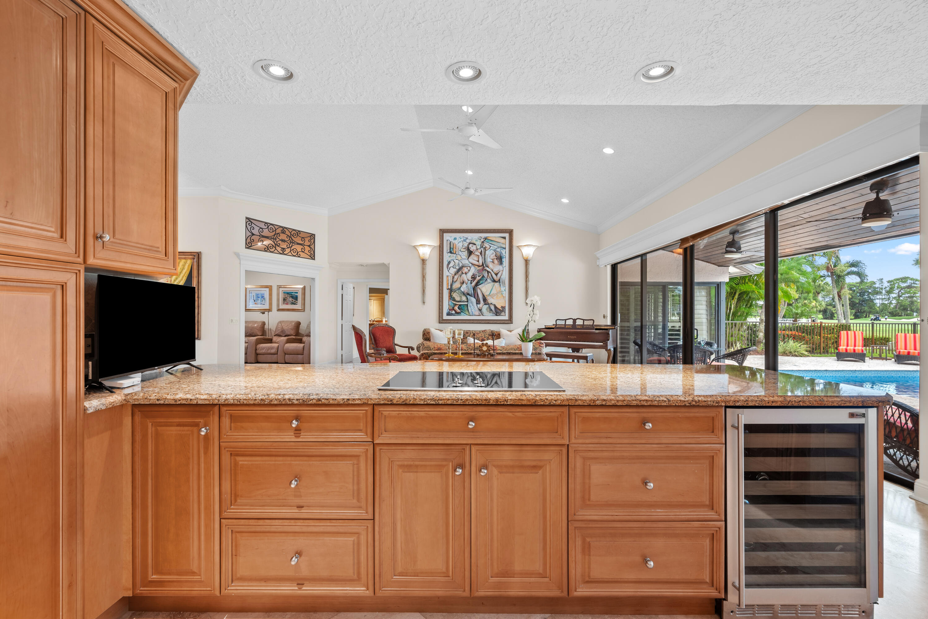 10984 Boca Woods Lane Boca Raton, FL 33428 - Photo 16 of 80 a kitchen with kitchen island granite countertop a sink and dishwasher with wooden floor