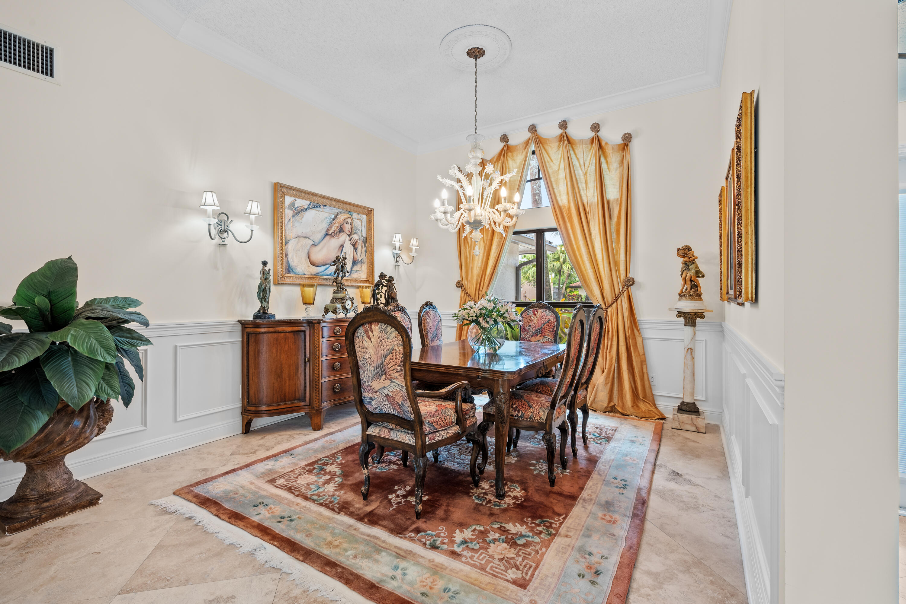 10984 Boca Woods Lane Boca Raton, FL 33428 - Photo 21 of 80 a view of a dining room with furniture and a potted plant