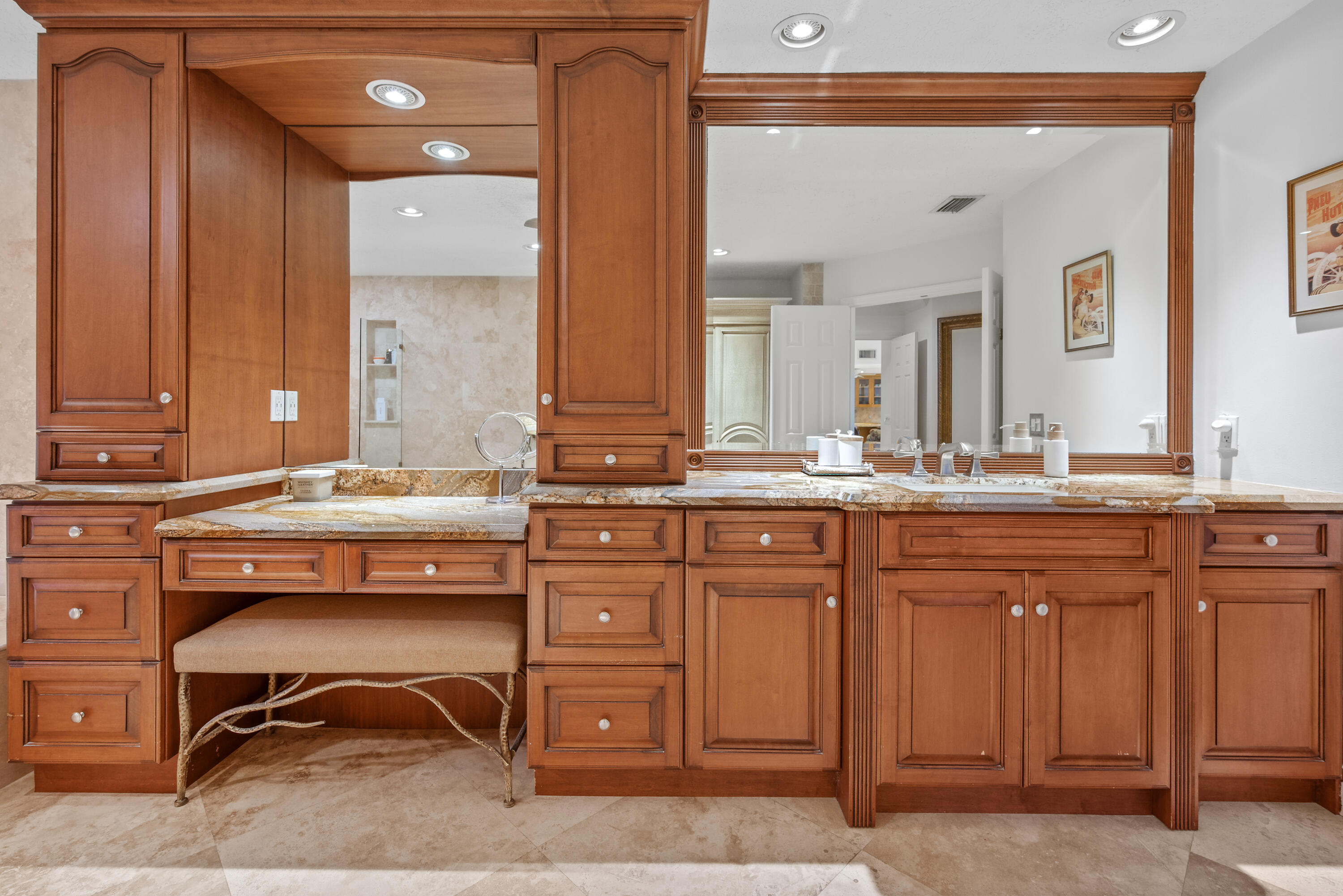 10984 Boca Woods Lane Boca Raton, FL 33428 - Photo 33 of 80 a spacious bathroom with a granite countertop sink and a mirror
