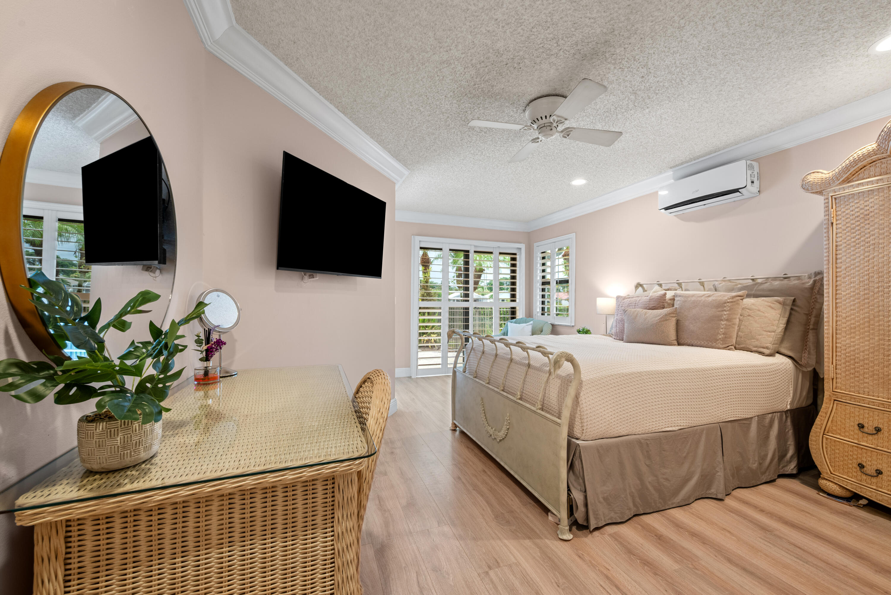 10984 Boca Woods Lane Boca Raton, FL 33428 - Photo 38 of 80 a bed room with furniture and a flat screen tv