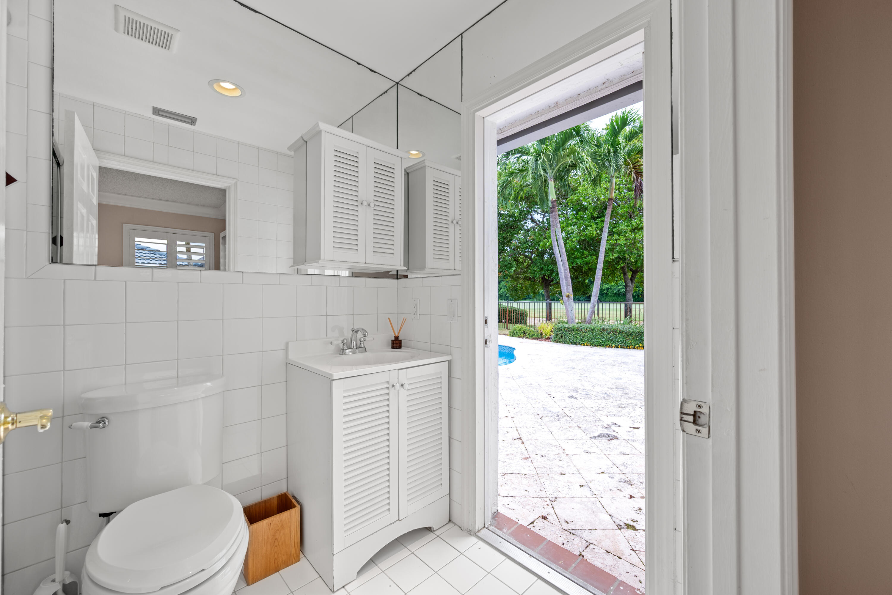 10984 Boca Woods Lane Boca Raton, FL 33428 - Photo 40 of 80 a bathroom with a toilet sink and shower