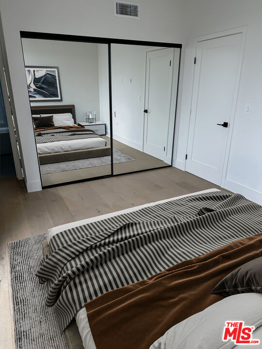 1900 20th Street, Unit B Santa Monica, CA 90404 - Photo 11 of 14 a view of bedroom with wooden floor