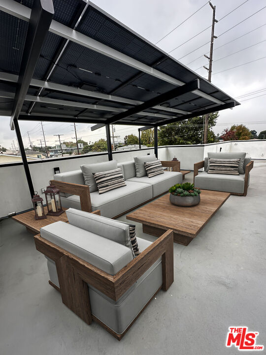 1900 20th Street, Unit B Santa Monica, CA 90404 - Photo 14 of 14 a living room with furniture and a glass door