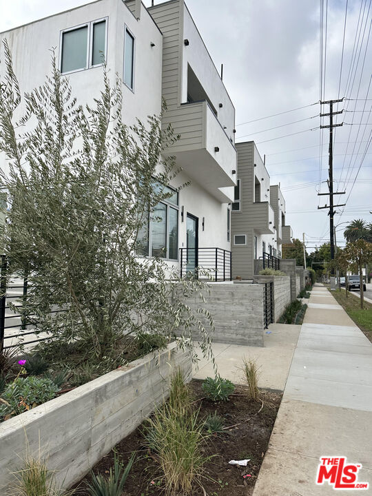 1900 20th Street, Unit B Santa Monica, CA 90404 - Photo 3 of 14 a front view of a house with trees