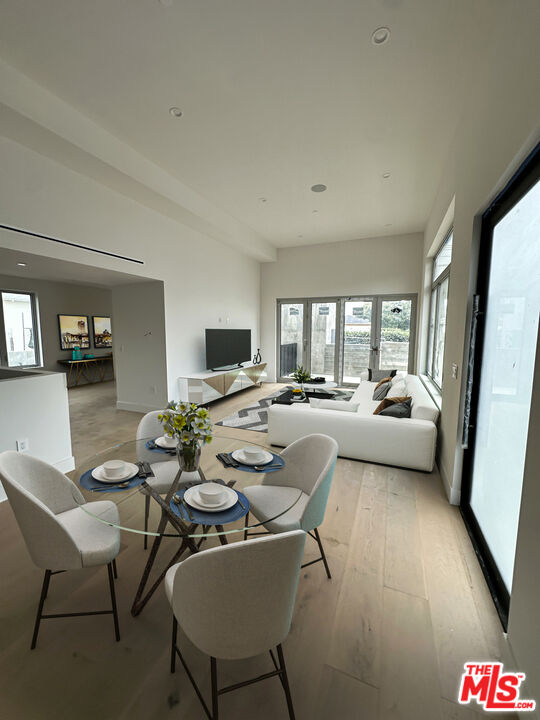 1900 20th Street, Unit B Santa Monica, CA 90404 - Photo 8 of 14 a living room with furniture and a flat screen tv