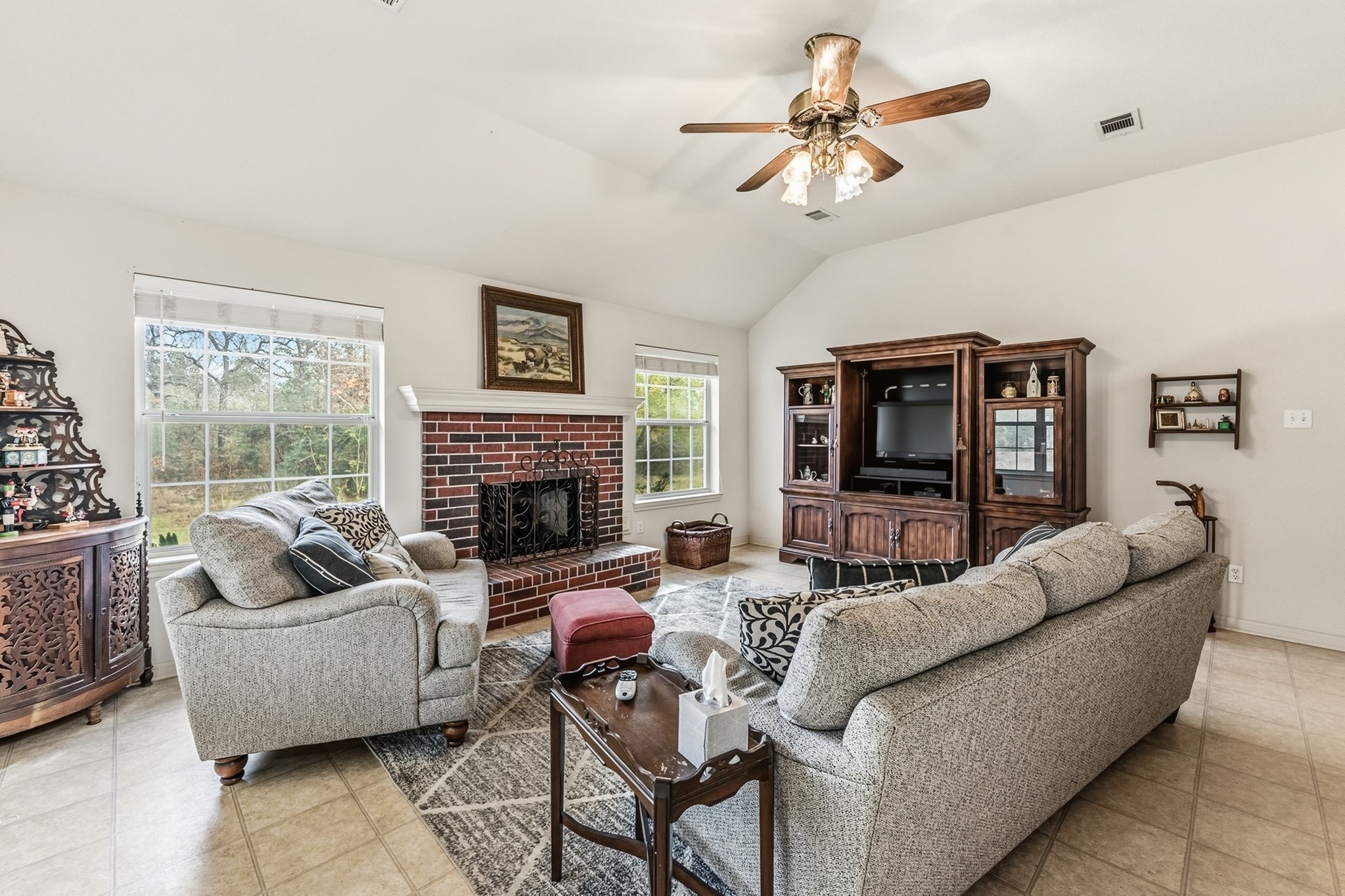 691 Bishop Road Huntsville, TX 77320 - Photo 8 of 32 a living room with furniture a fireplace and a large window