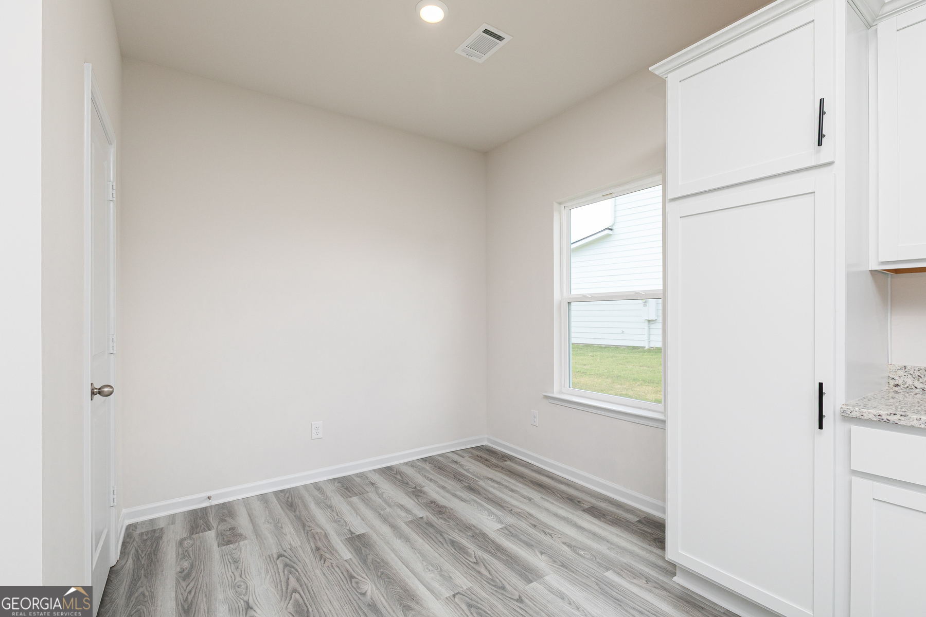 526 Plant Road Conyers, GA 30013 - Photo 6 of 11 a view of an empty room and a window