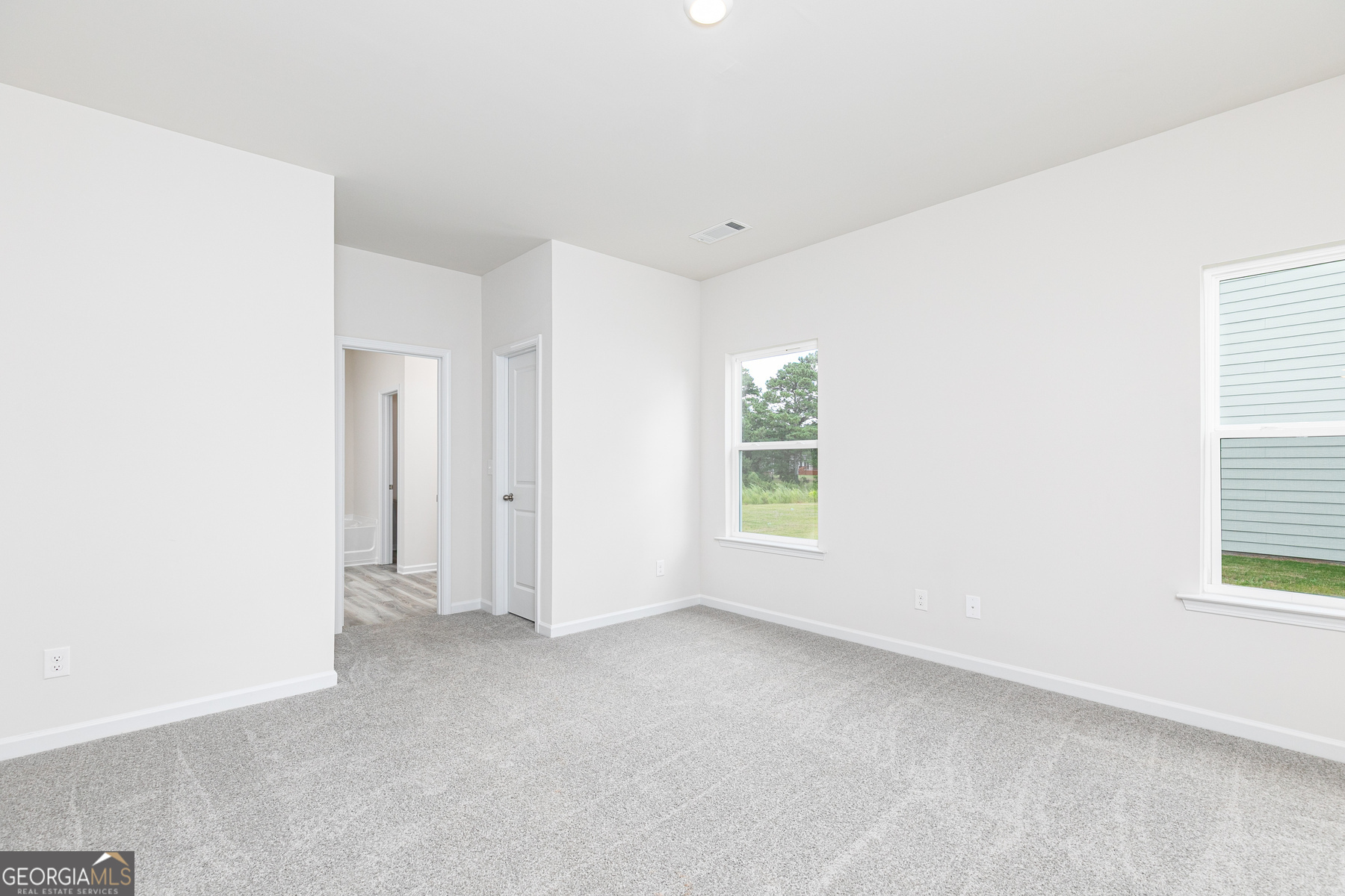 526 Plant Road Conyers, GA 30013 - Photo 7 of 11 a view of an empty room with a window