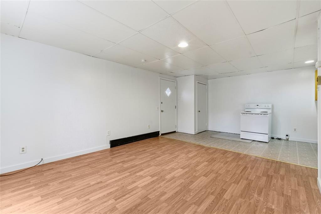 1057 Keene Street Springdale, PA 15144 - Photo 40 of 50 a view of empty room with wooden floor