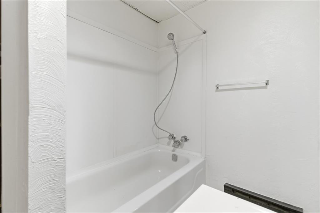 1057 Keene Street Springdale, PA 15144 - Photo 42 of 50 a bathroom with a bathtub