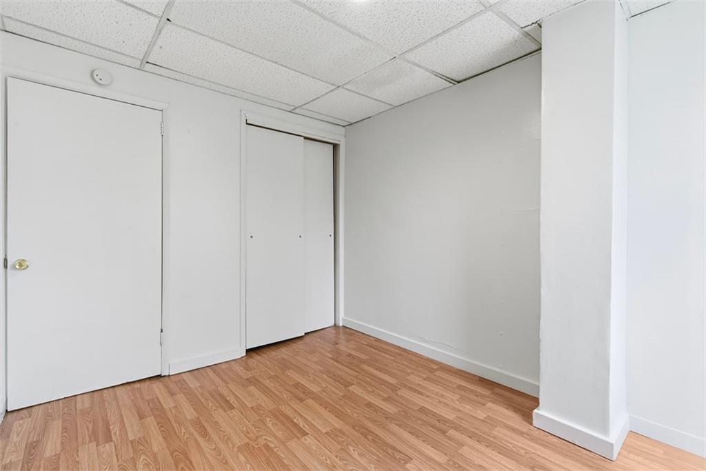 1057 Keene Street Springdale, PA 15144 - Photo 44 of 50 a view of an empty room with wooden floor