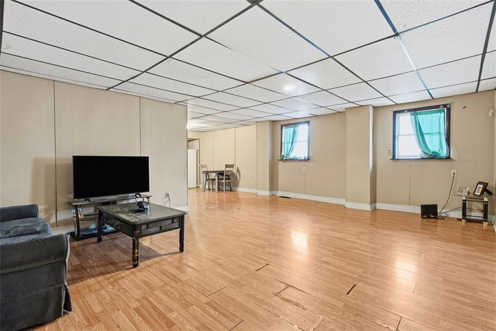 1057 Keene Street Springdale, PA 15144 - Photo 10 of 50 a view of a livingroom with workspace and a window