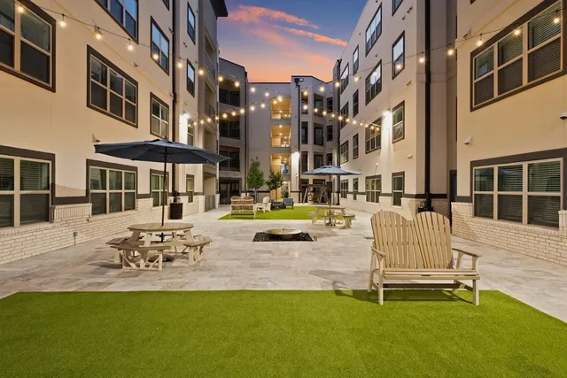 a view of a building with backyard