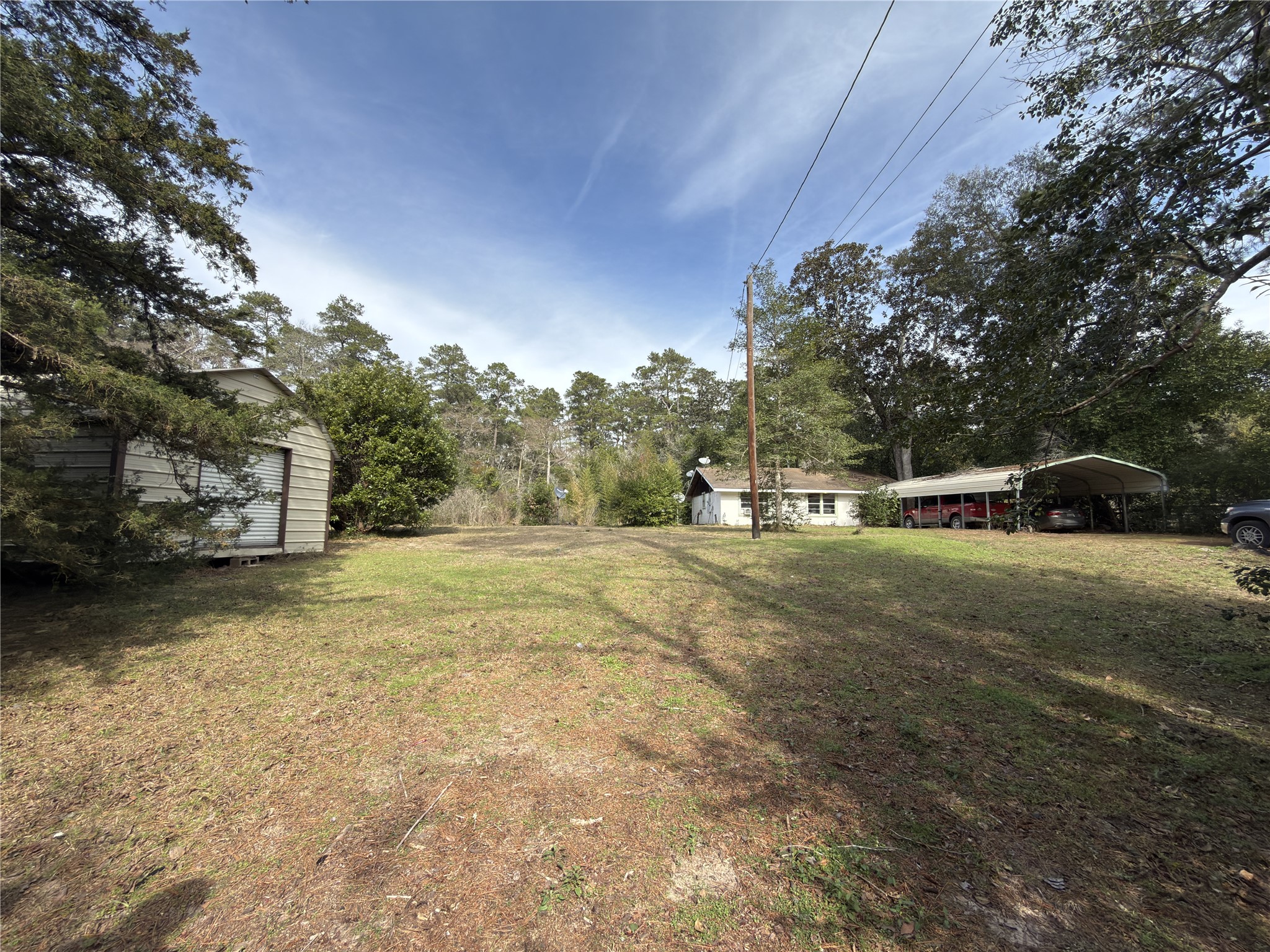257 County Road 2142 Cleveland, TX 77327 - Photo 6 of 18 a view of street with parked cars